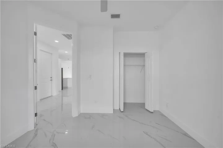Unfurnished bedroom featuring recessed lighting, a closet, and ceiling fan