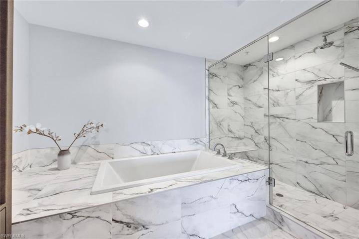 Luxury at its finest! Gorgeous, tiled walk-in shower and soaking tub!