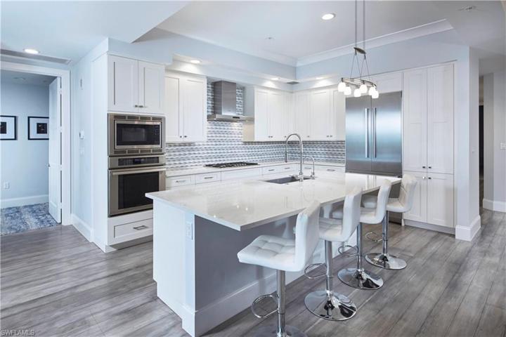 Stainless appliances, quartz countertops, custom lighting and backsplash.