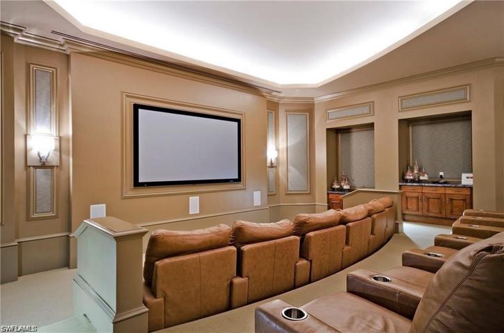 Theatre room located in amenity center, steps from the unit.