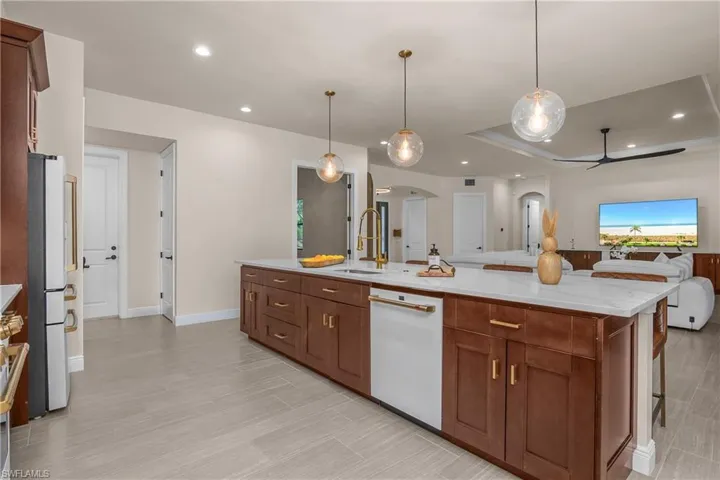 The kitchen is spacious and overlooks the open great room and dining space.
