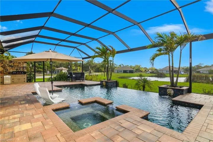 Enjoy your own outdoor oasis with recently sealed pavers, custom pool and spa, and a sprawling outdoor living space.
