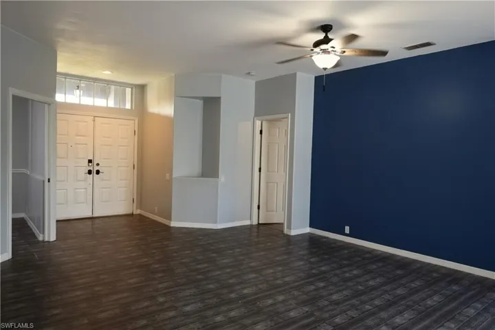 Entryway featuring double doors with transom window
