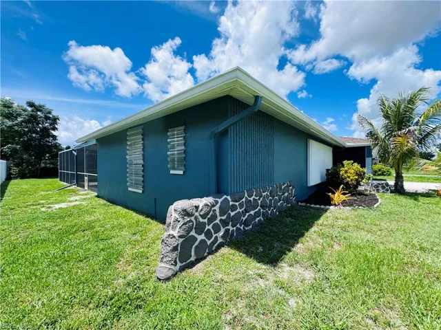 View of home's exterior featuring a yard