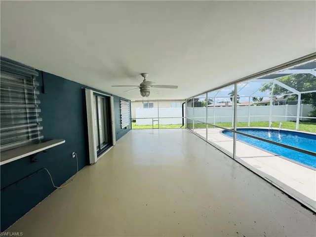 View of pool featuring ceiling fan