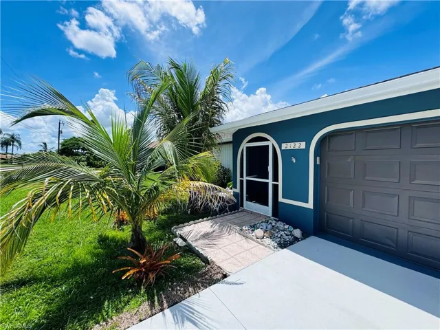 View of exterior entry featuring a garage