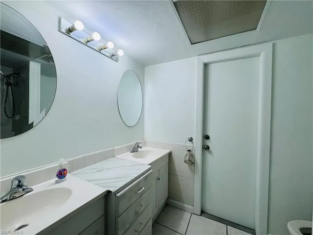 Bathroom featuring vanity and tile patterned flooring