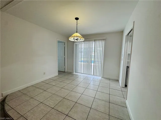 Spare room with light tile patterned floors