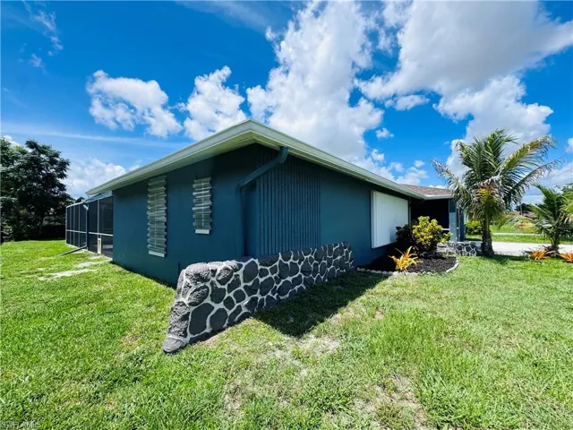 View of home's exterior featuring a lawn