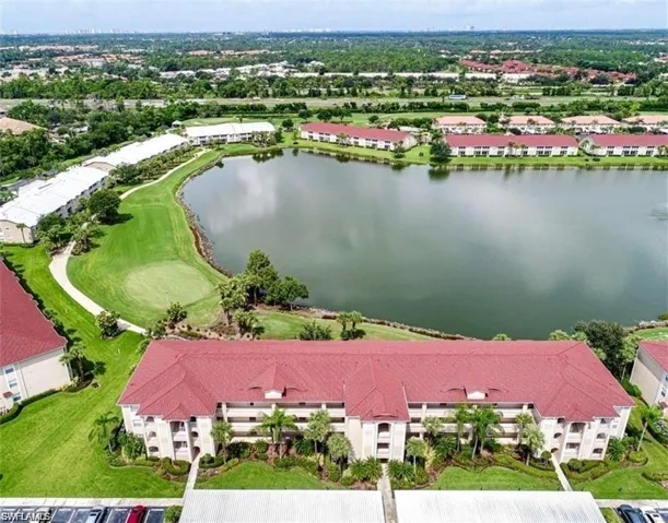 Bird's eye view of a large body of water and apartment complex / building