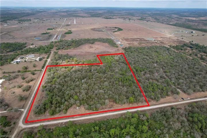 Aerial overview of property's location with rural landscape and property parcel outlined