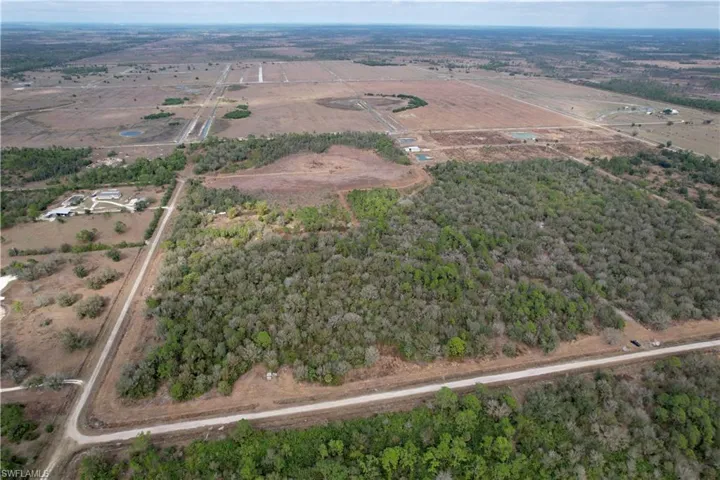 Aerial view of property's location with rural landscape