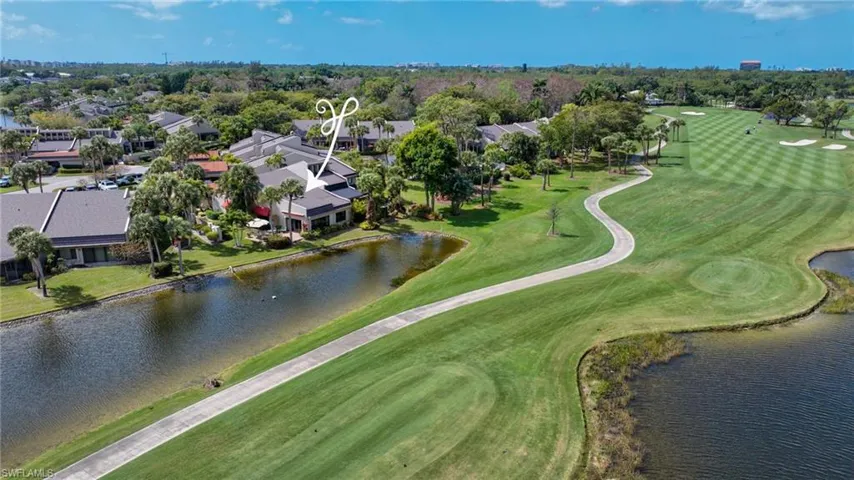 Aerial view of a golf course and a large body of water