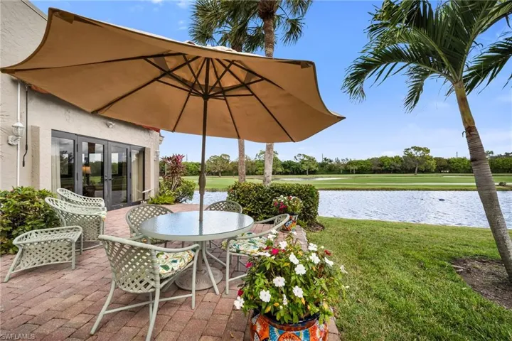 View of patio / terrace with outdoor dining space, french doors, and a water view