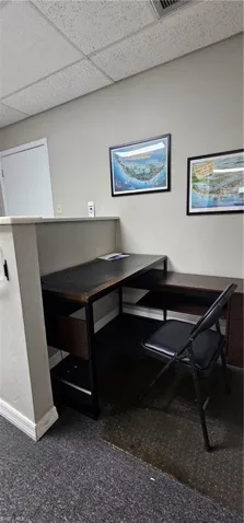 Office featuring a paneled ceiling