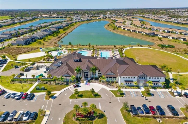 Aerial perspective of suburban area featuring a large body of water