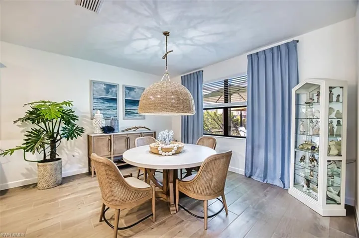 Dining area featuring light wood finished floors and baseboards