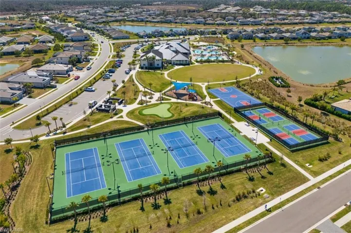 Aerial perspective of suburban area with a nearby body of water