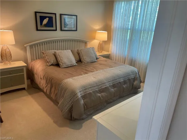 Bedroom with light carpet