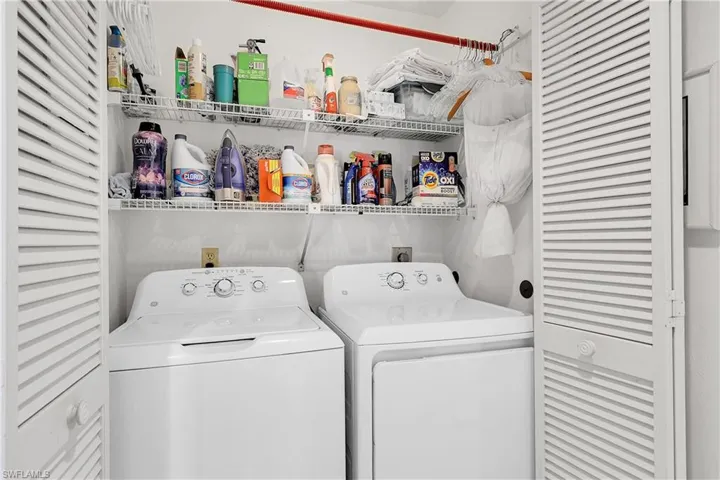 Laundry area featuring washer and clothes dryer