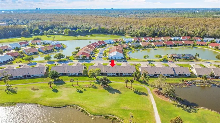 Aerial perspective of suburban area with a large body of water