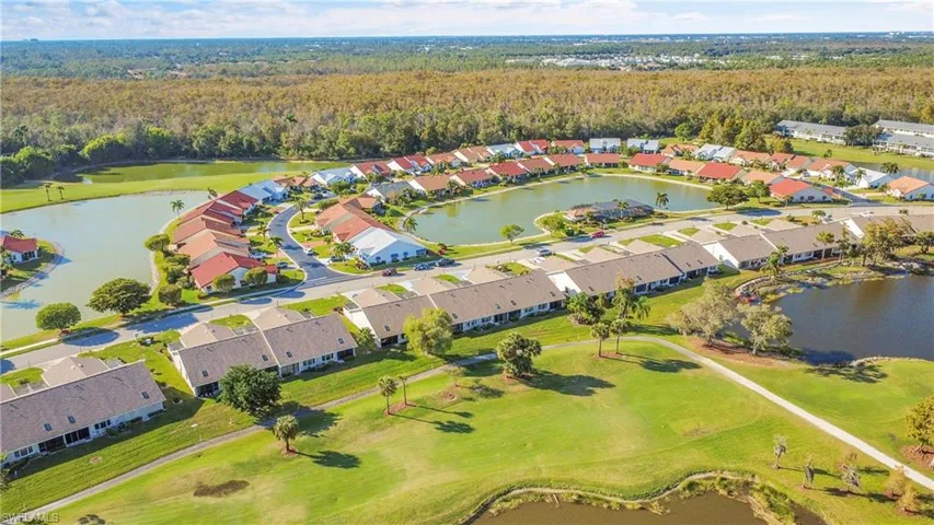 View of property location with a large body of water and nearby suburban area