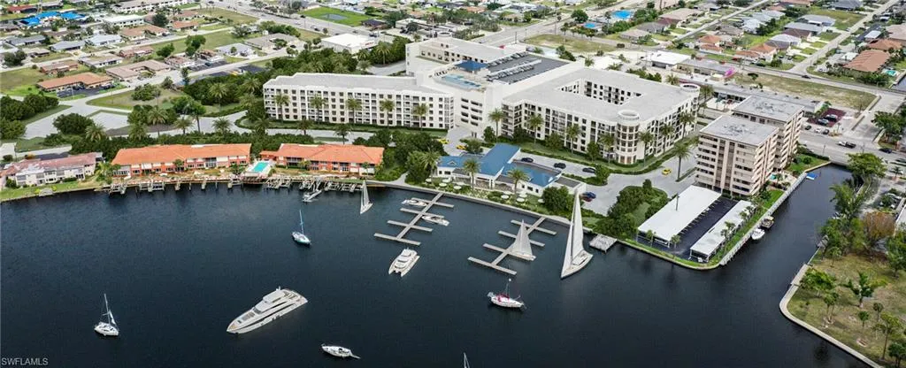 Aerial view of property's location featuring a large body of water