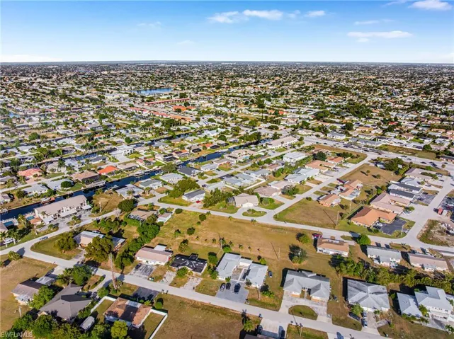 Aerial overview of property's location featuring nearby suburban area and a large body of water