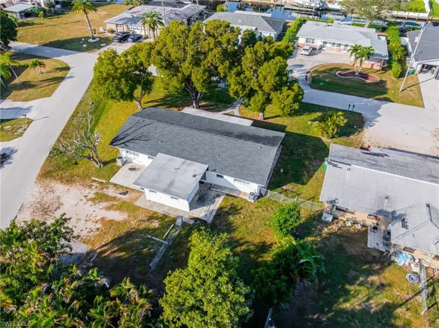 Aerial overview of property's location with nearby suburban area