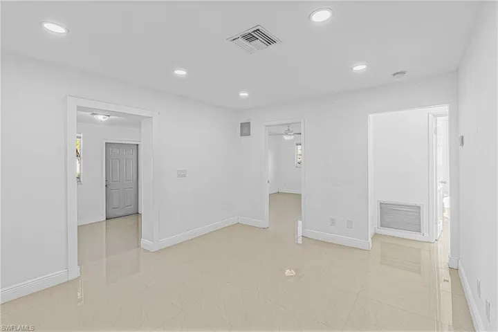 Unfurnished room with recessed lighting, light marble finish flooring, and a ceiling fan