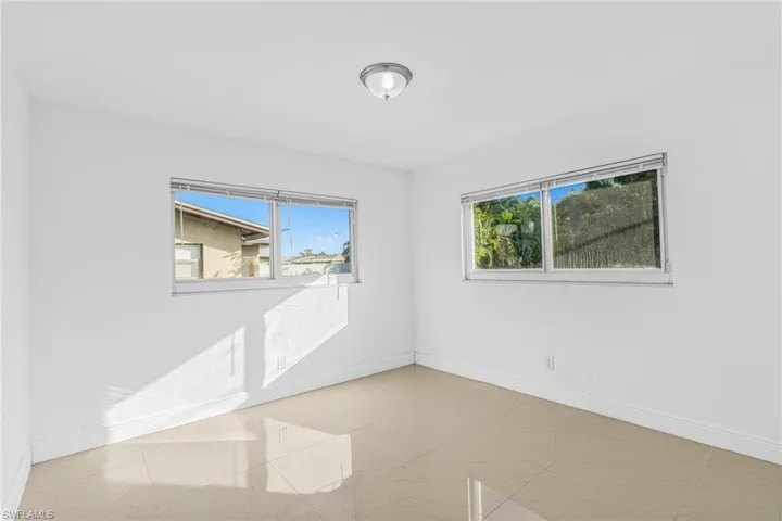 Spare room featuring baseboards