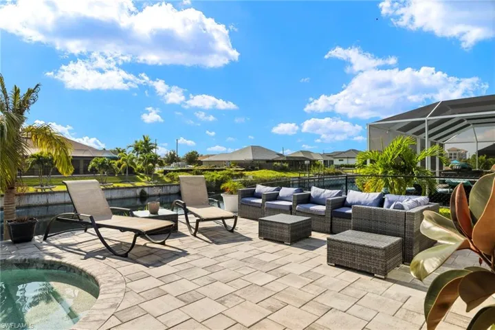 View of patio featuring outdoor lounge area, a pool, and a lanai