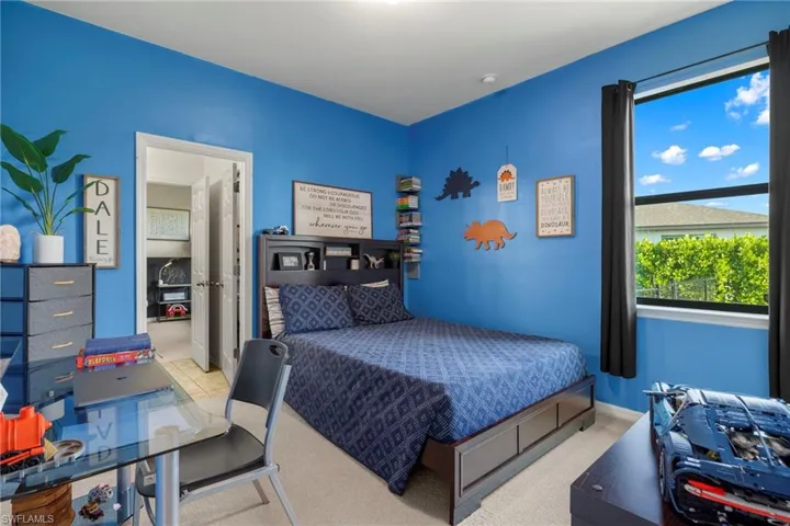 Bedroom with light carpet