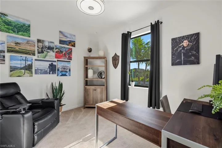 Home office with light colored carpet
