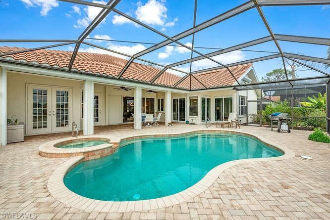 Pavered pool deck with lots of covered seating.
