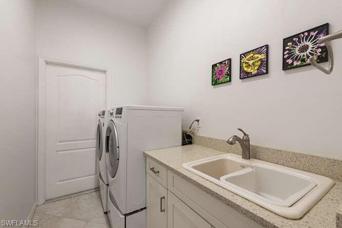 Laundry room with upgraded counters.