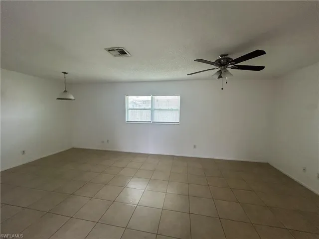 Spare room featuring a ceiling fan