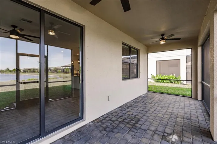 Unfurnished sunroom with a water view and plenty of natural light