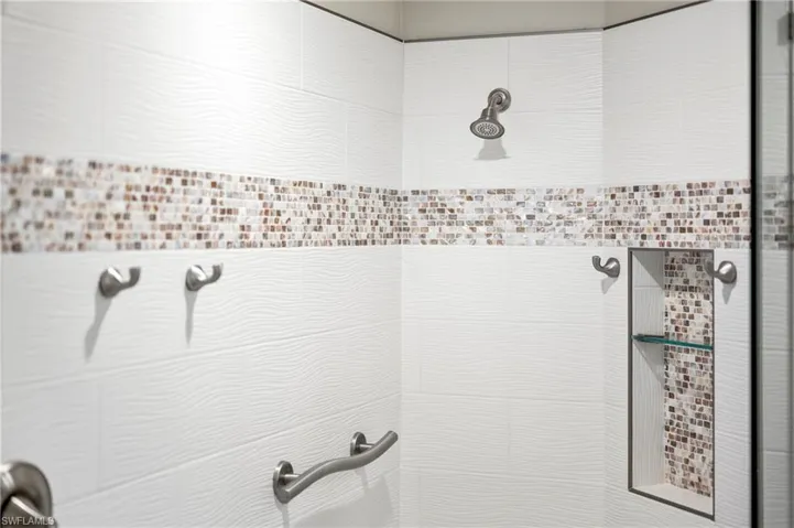 Bathroom featuring a tile shower