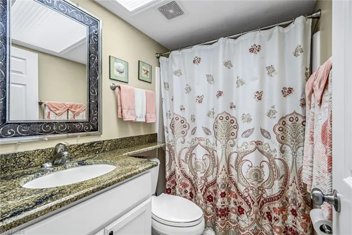 Guest bathroom with a shower/tub, updated vanity.