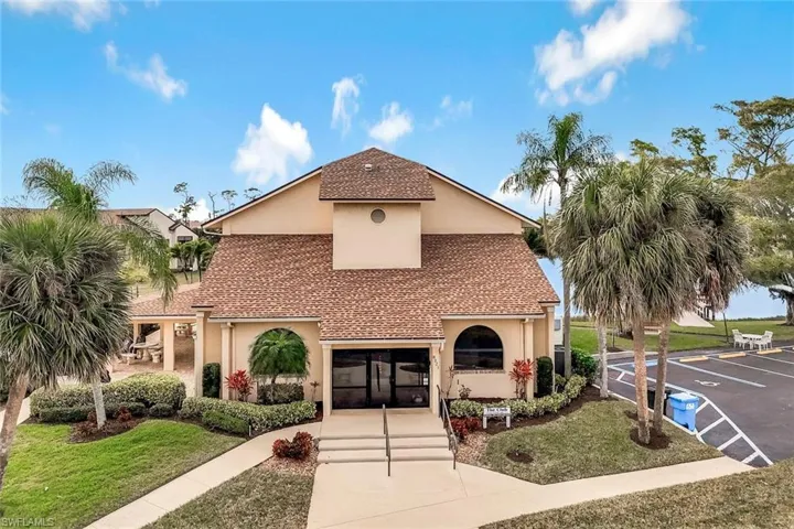Front view of clubhouse at Club at Crystal Lake Condominium community.
