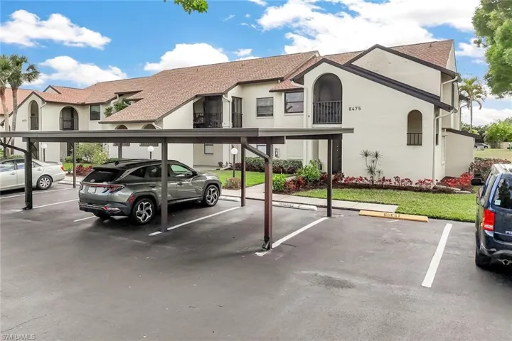 Covered parking for Unit #8 and adjacent guest parking.