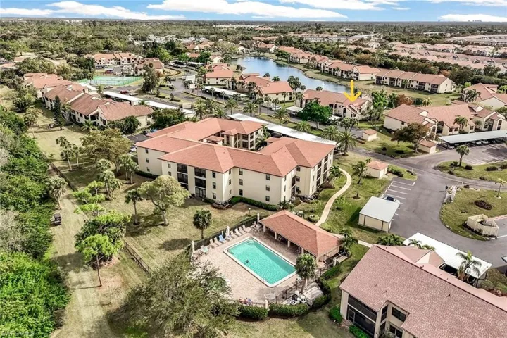 Aerial view of adult pool located very close to 8475 Charter Club Circle #8.