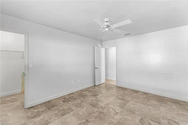 Unfurnished bedroom #2 featuring a spacious closet and ceiling fan