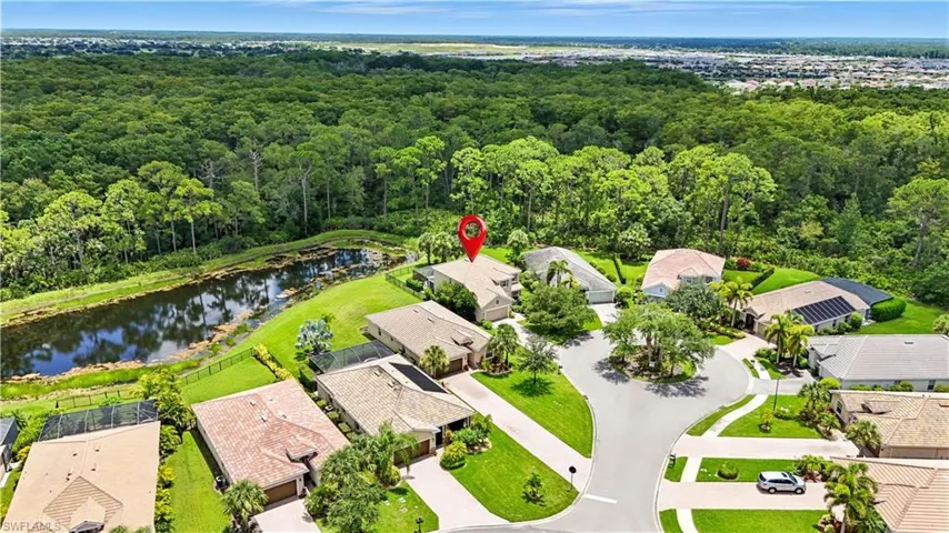 Beautiful pond-front home on a quiet cul-de-sac featuring a tile roof, tropical landscaping, and a brick-paved driveway. Enjoy private preserve views with no rear neighbors, creating a serene backyard retreat. Conveniently located near Gulf beaches, shopping, dining, and top Southwest Florida attractions—perfect for year-round or seasonal living!