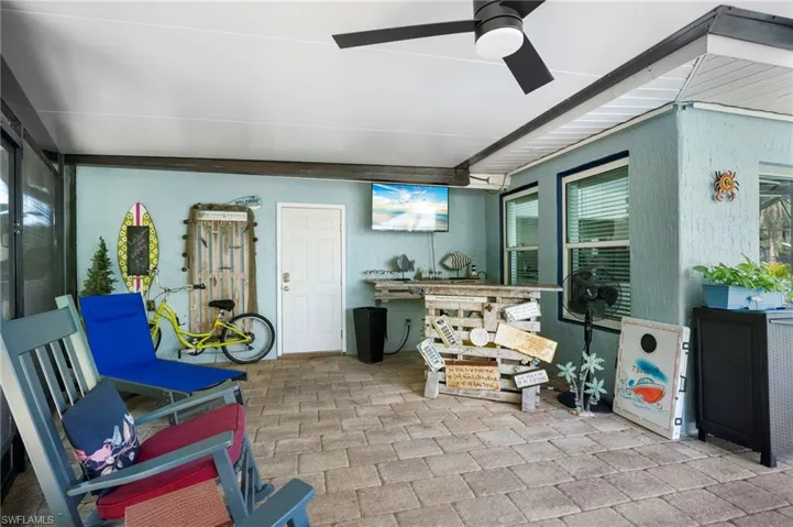 View of patio with a ceiling fan