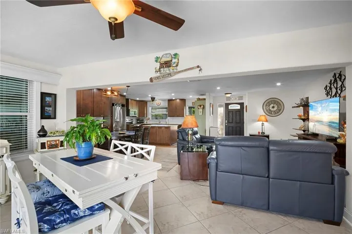 Dining room featuring ceiling fan, light tile patterned floors, and recessed lighting