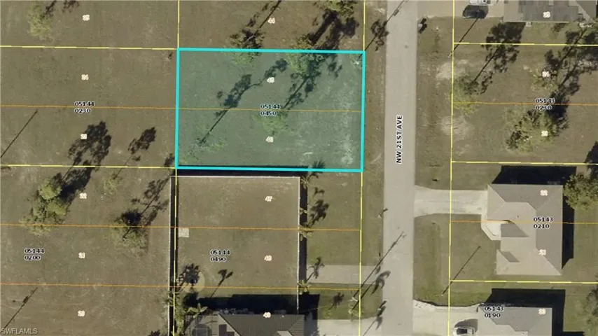 Aerial map of property and surrounding area featuring property boundaries highlighted