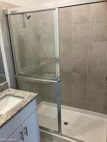 Bathroom featuring vanity and walk in shower