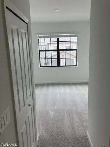 Empty room featuring carpet flooring